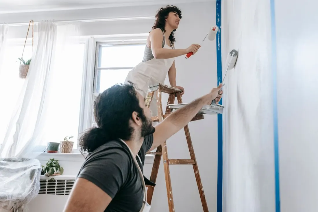 Painters at work on an interior wall