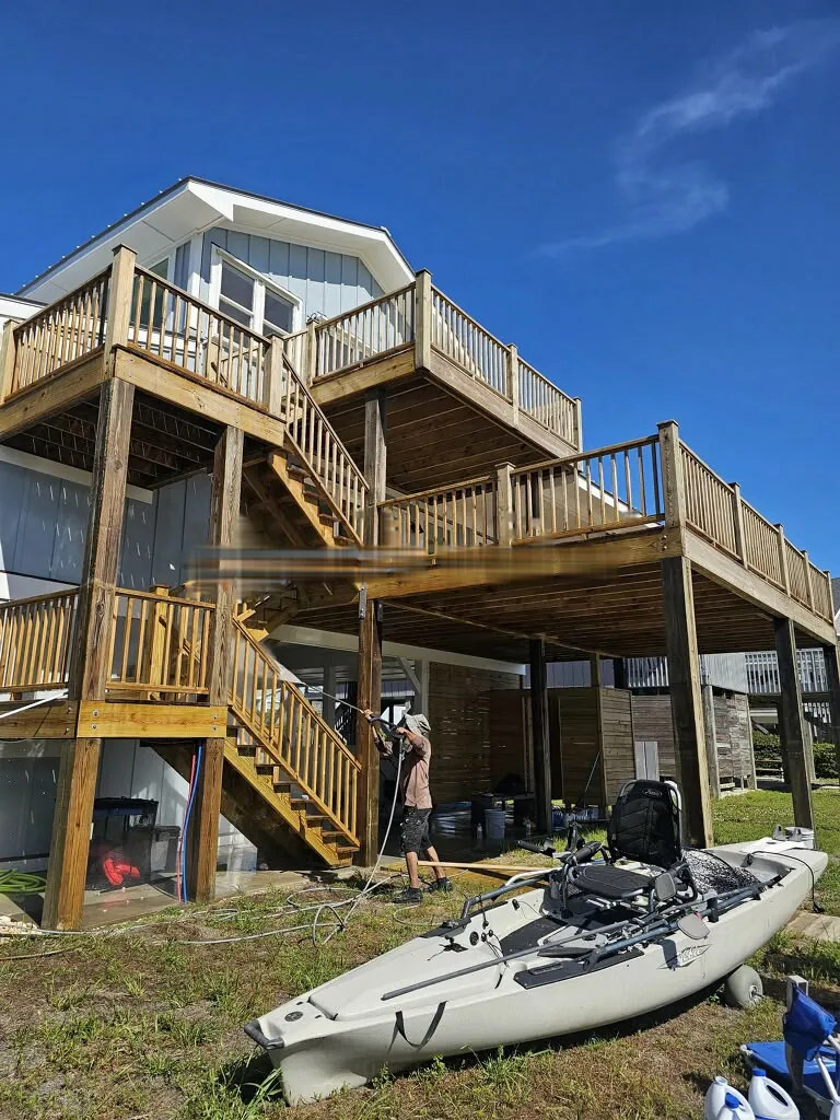 Pressure washing a stilt house deck