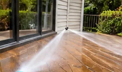 Pressure washing a wooden deck